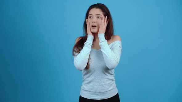 The Portrait of a Charismatic Young Woman Seems to Pantomime with Her Hands alt