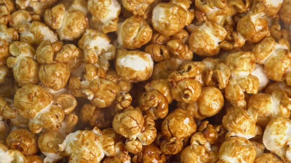 Coffee taste hot popcorn with smoke rotating close up. Caramel popcorn. Healthy food for morning alt
