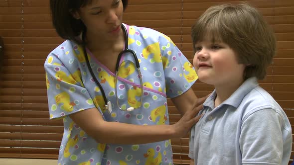 Female Nurse Gives Young Boy A Checkup