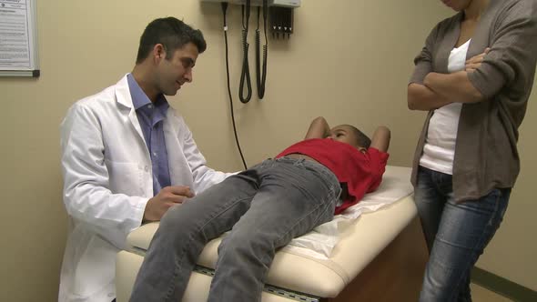 Male Doctor Examines Sick Child (4 Of 4)