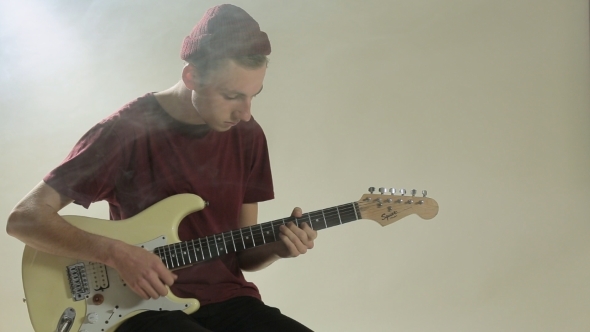 Guy In Hat Playing Guitar In The Studio In The, Stock Footage | VideoHive