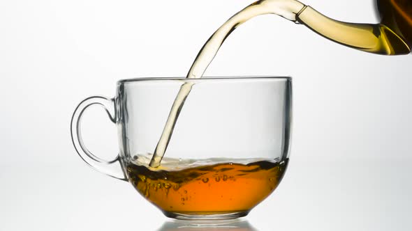 Fragrant Tea Is Poured Into A Cup