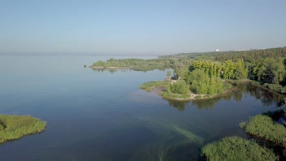 Aerial View on Calm Landscape with Lakes, River, Forest and Sandy Coasts in Sunny Morning