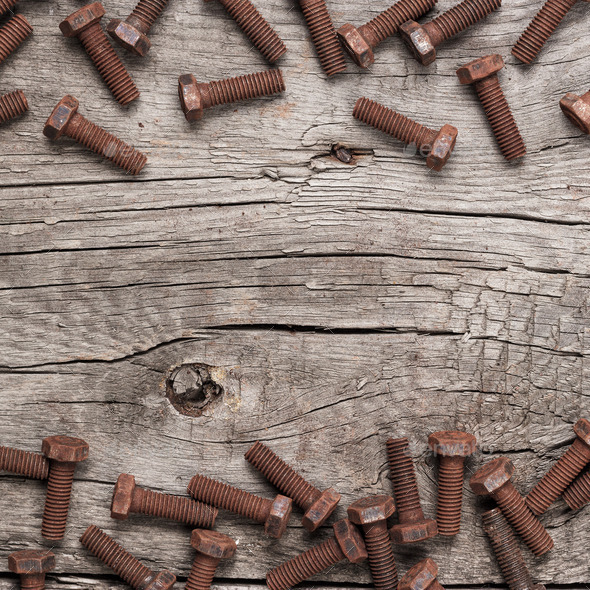 Rusty Screw Bolt On The Wooden Table - Stock Photo - Images