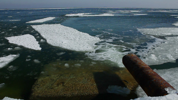 Sewage Pipe Merges into the Sea