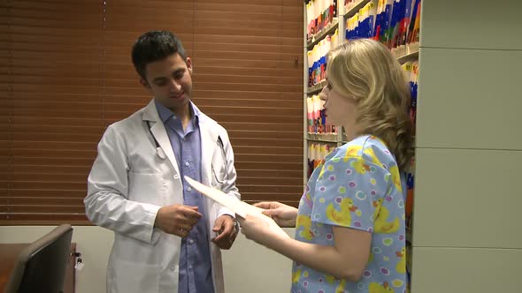 Nurse Helps Doctor Find Medical Chart