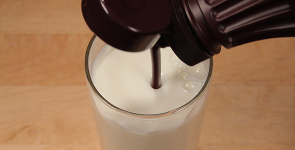 Mixing Chocolate Syrup Into Milk