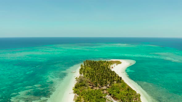 Travel Concept with a Sandy Beach and Blue Sea alt