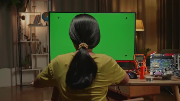 Engineer Asian Girl Is Working With Desktop Computer In Home, Mock Up Green Screen Display alt