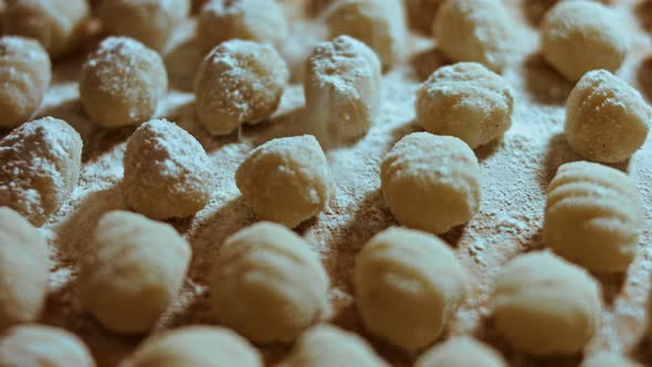 Chef Cutting Rolls of Potato Dough for the Preparation of Homemade Gnocchi Pleasant Atmosphere alt