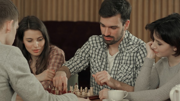 Friends spending time playing chess