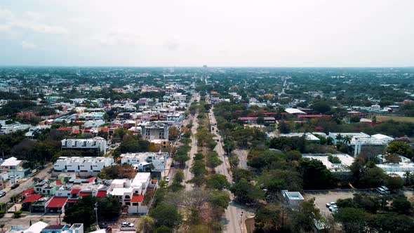 Drone view of Merida Avenue in mexico with railroad at the middle alt
