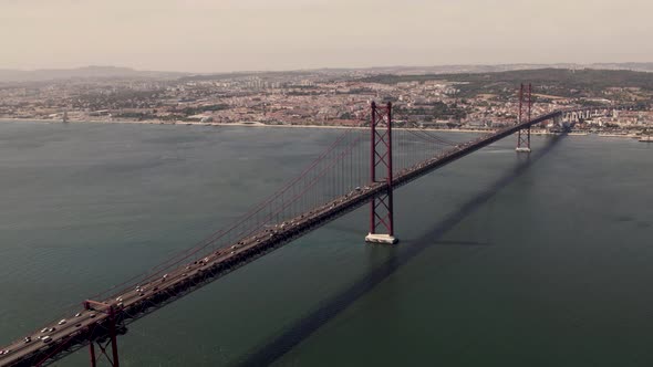 The 25 de Abril Bridge, suspension bridge over Tagus river connecting Lisbon to Almada alt