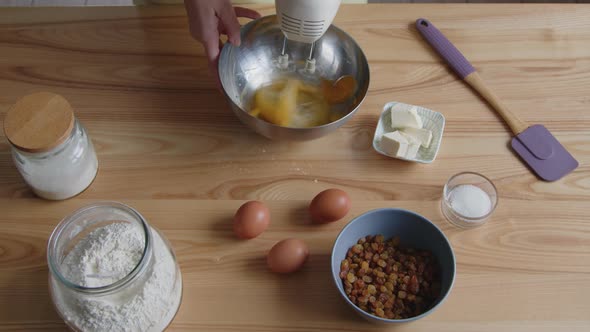 Woman Is Mixing Eggs With Electric Mixer