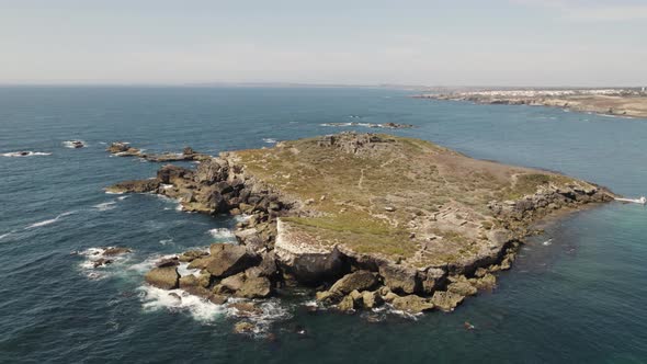 Pessegueiro Island fort, orbital shot of fortification in Porto Covo Portugal