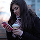 Girl Typing On A Mobile Phone Girl Typing On A Mobile Phone - VideoHive Item for Sale