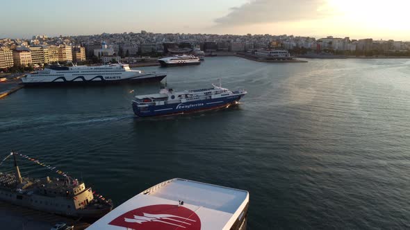 Drone View of a Small Sailing Ship in the Port of Athens After Sunset alt