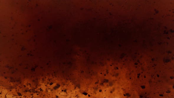 Instant coffee particles dissolving in water, shot with Phantom Flex 4K at 1000 frames per second alt