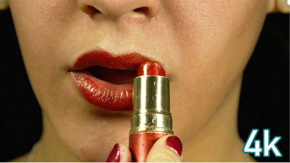 Girl Applying Lipstick
