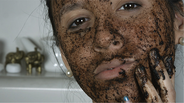 Girl Applying Cosmetic Face Mask