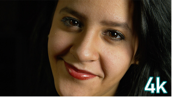 Girl Holding a Necklace Smiling alt