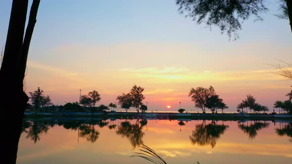 Aerial View Scenery Reflection Of Beautiful Sky In The Pond. alt