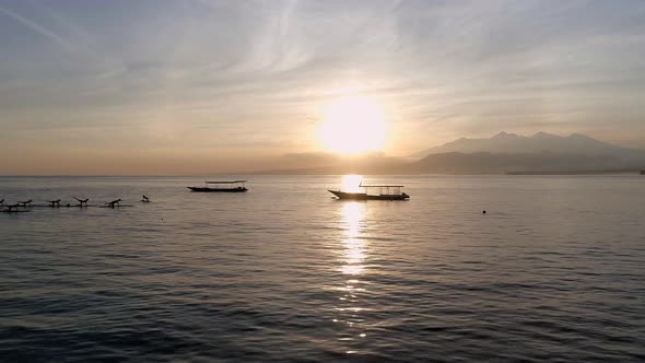 Sunrise Yoga Class on Stand Up Paddle Boards in the Calm Ocean alt
