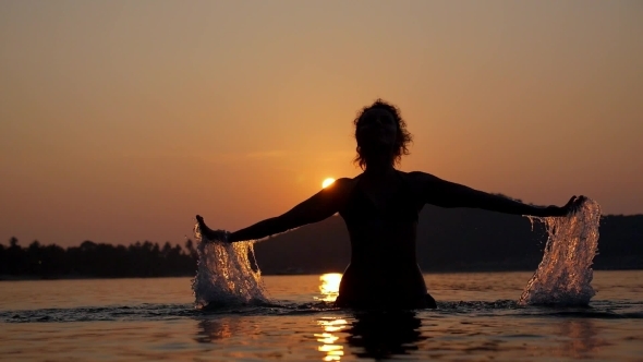 Sensual Woman Open Arms At Sunset In The Sea alt