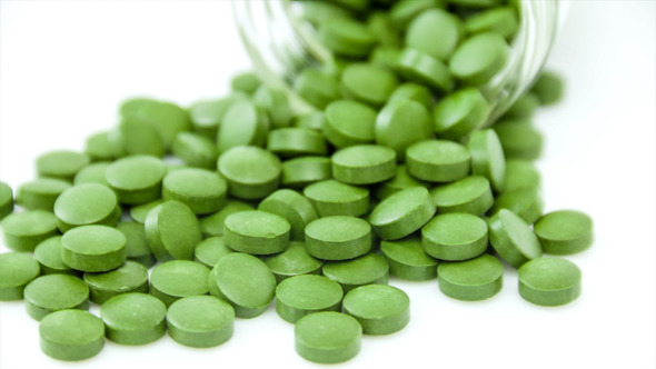 Green Medical Pills on the Rotating Table