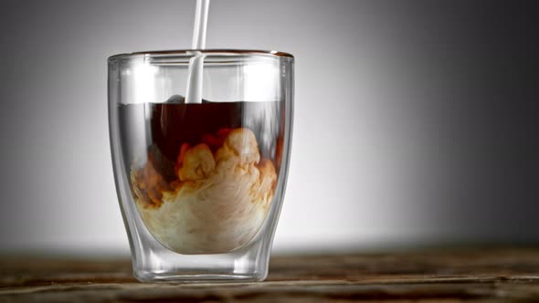 Super Slow Motion Shot of Pouring Cream Into Coffee Drink at 1000Fps alt