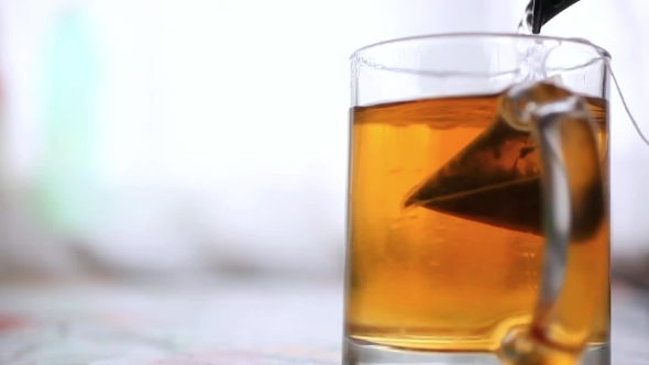 Pouring Boiling Water Into a Glass And Brewing Tea, Stock Footage ...