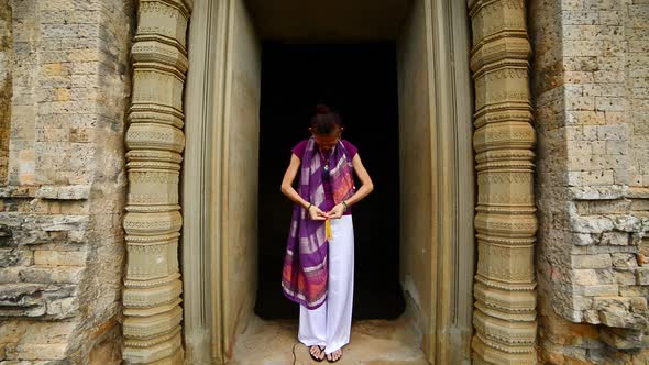 Female Buddhist Praying With Incense In Temple Doorway -   Angkor Wat Temple Cambodia 5