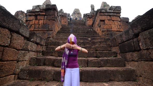 Female Buddhist Slowly Walking Down Temple Steps With Incense -  Angkor Wat Temple Cambodia 1