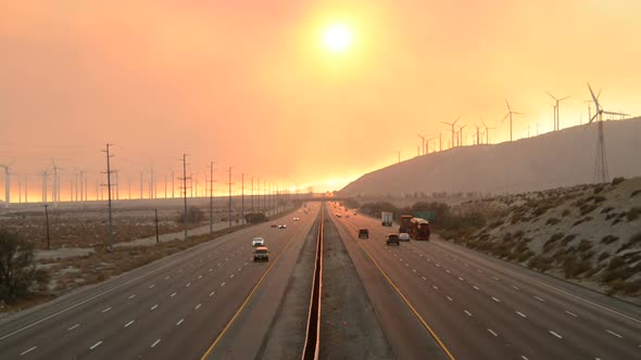 Traffic On Highway With Fire Smoke Sunset