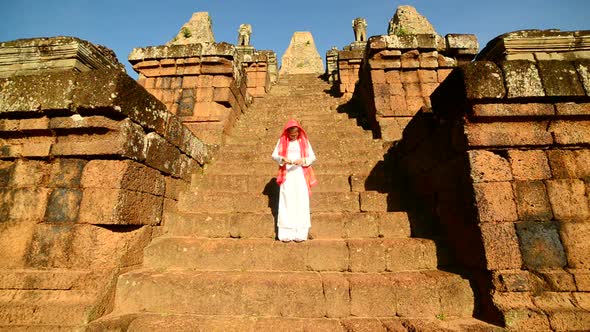 Female Buddhist Slowly Walking Down Temple Steps With Incense -  Angkor Wat Temple Cambodia 2