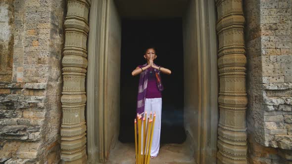 Female Posing Like Buddhist Statue In Temple Doorway With Incense-  Angkor Wat Temple Cambodia 1