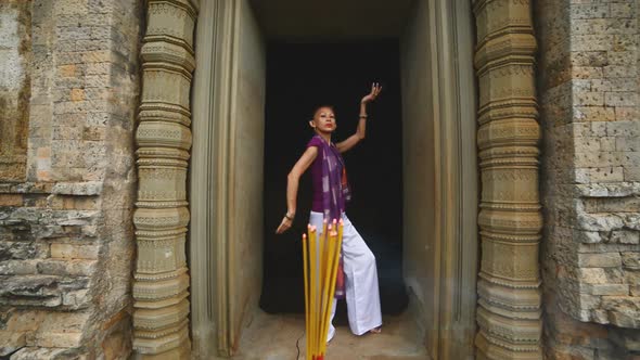 Female Posing Like Buddhist Statue In Temple Doorway With Incense-  Angkor Wat Temple Cambodia 2