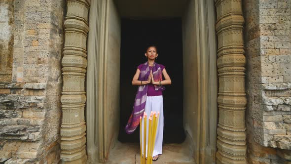 Female Posing Like Buddhist Statue In Temple Doorway With Incense-  Angkor Wat Temple Cambodia 3