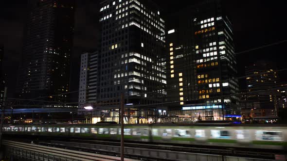Train Passes Over Bridge In Central Tokyo Japan At Night 1