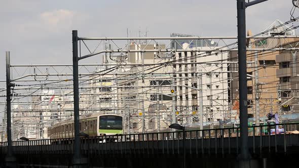 Train Passes Over Bridge In Central Tokyo Japan Daytime