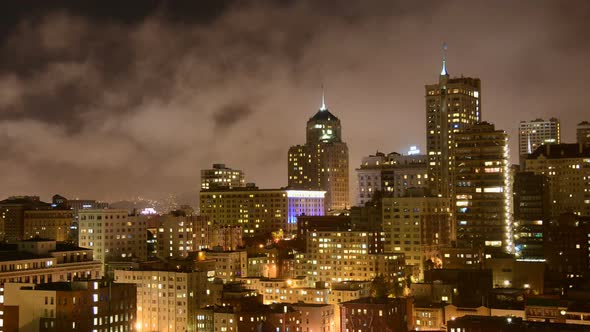 Fog Passing Over San Francisco Skyline At Night 2