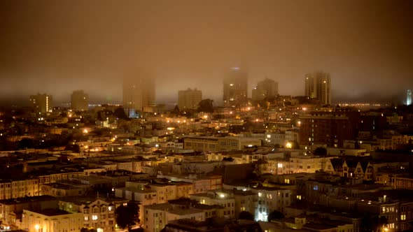 Fog Passing Over San Francisco Skyline At Night 4