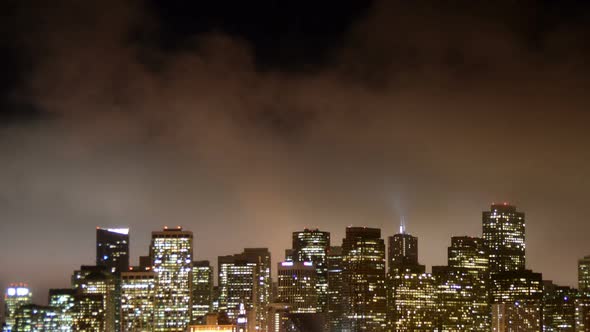 Fog Passing Over San Francisco Skyline At Night 5