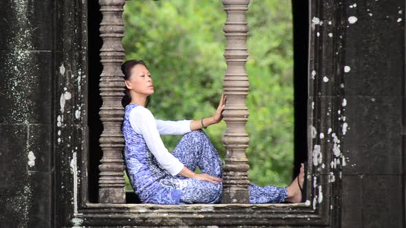 Female Buddhist Meditating In Temple Window - Angkor Wat, Cambodia