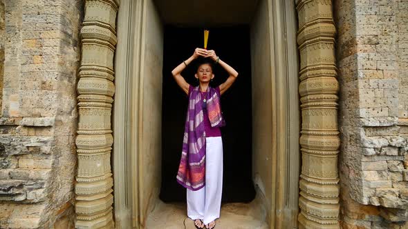 Female Buddhist Praying With Incense In Temple Doorway -   Angkor Wat Temple Cambodia 1