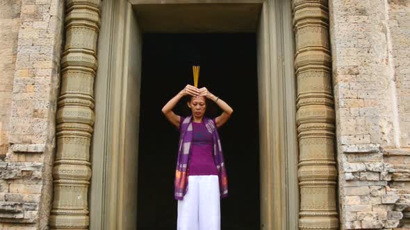 Female Buddhist Praying With Incense In Temple Doorway -   Angkor Wat Temple Cambodia 4