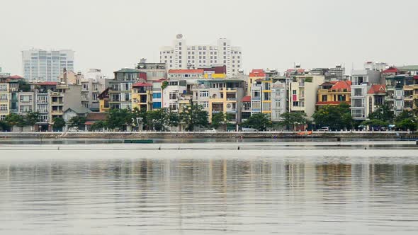 Hanoi Vietnam -Colorful Apartment Buildings On A Scenic Lake