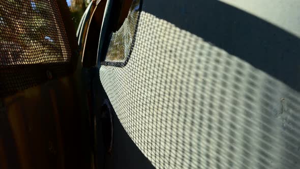 Shadows Creep Along Abandon Bus In The Mojave Desert