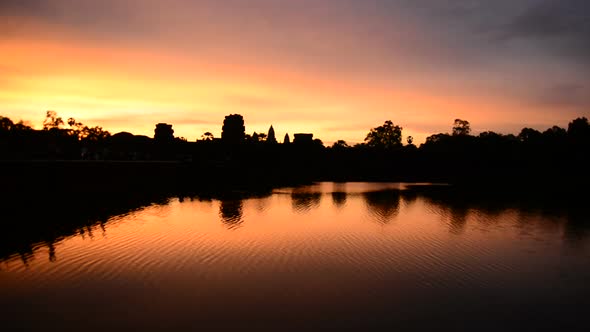 Silhouette Of The Main Temple Buildings With Lake Reflection At Sunrise - Angkor Wat, Cambodia 1