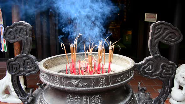 Incense Sticks Burning In Giant Pot In Front Of Buddhist Temple 2